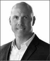 A person in a suit
Description automatically generated